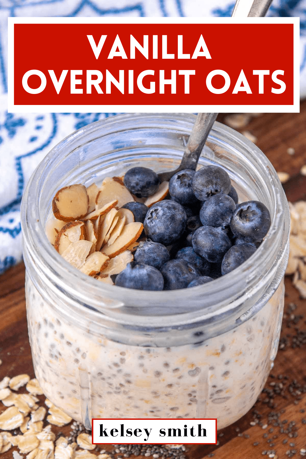Vanilla overnight oats in a 12 ounce Mason jar topped with blueberries and sliced almonds. Text at the top reads Vanilla Overnight Oats.