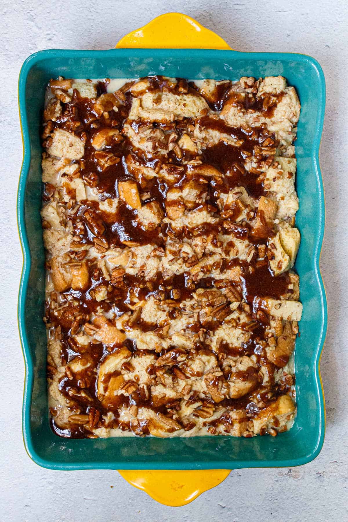 Brown sugar butter mixture drizzled over French toast casserole.