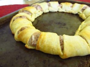 Baked tuna crescent ring on a sheet tray.