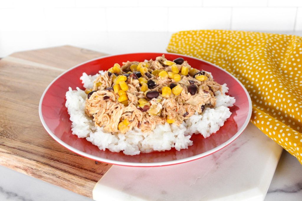 Slow cooker fiesta chicken over rice