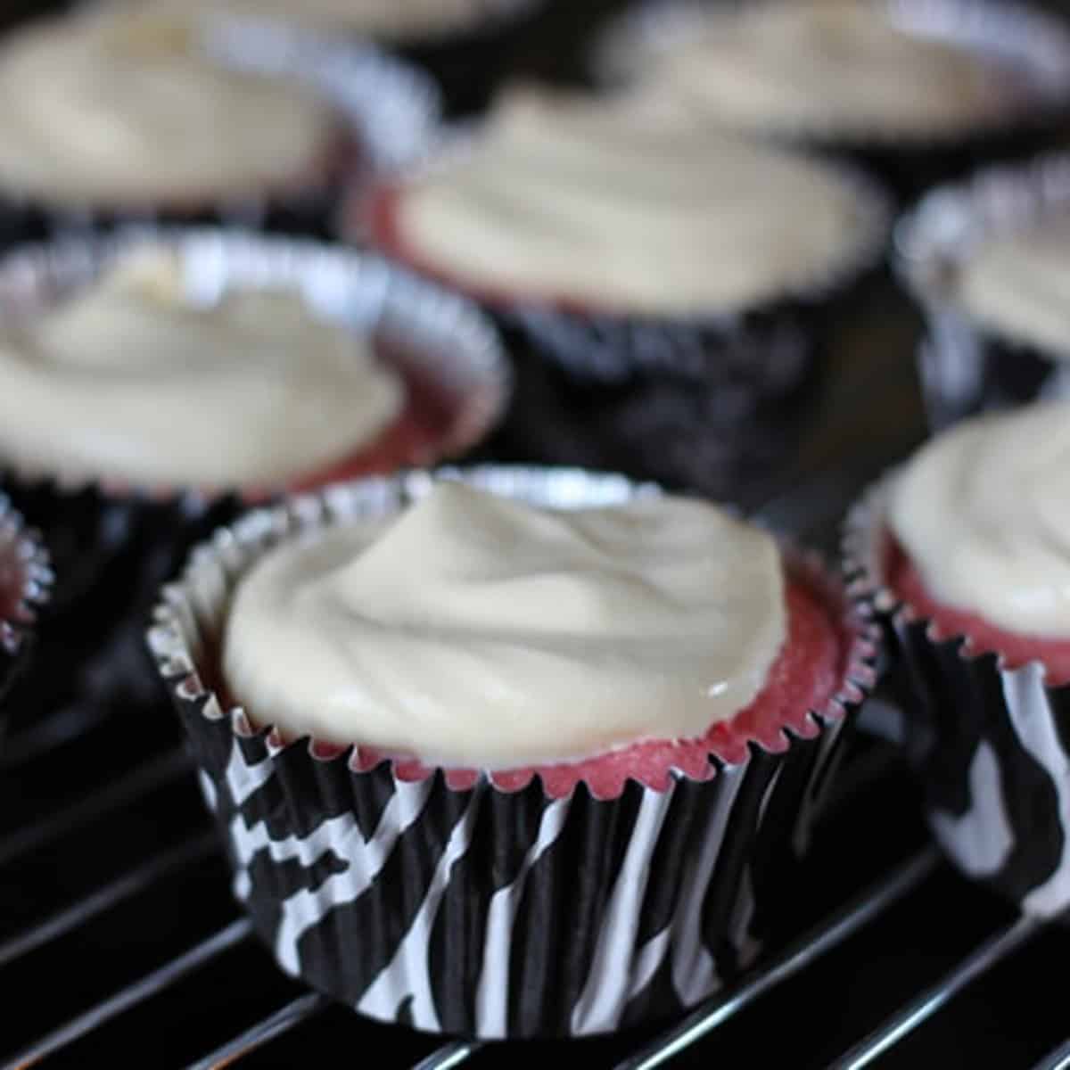 Cupcake topped with cool whip frosting.
