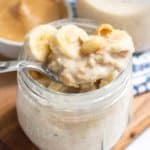 Peanut Butter Overnight Oats in a mason jar with banana slices on top.