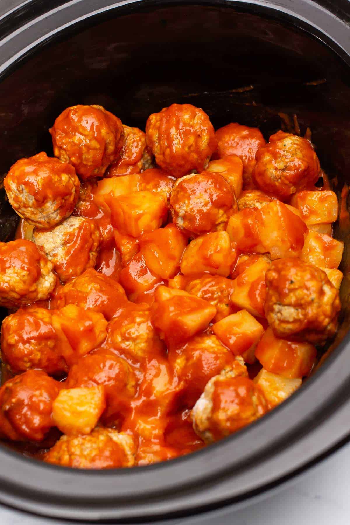 Frozen meatballs, sloppy joe sauce, and pineapple chunks tossed together in the slow cooker.