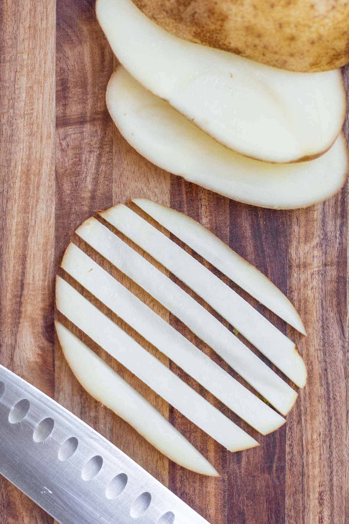 A thin horizontal potato slice cut into half-inch potato sticks to make French fries.
