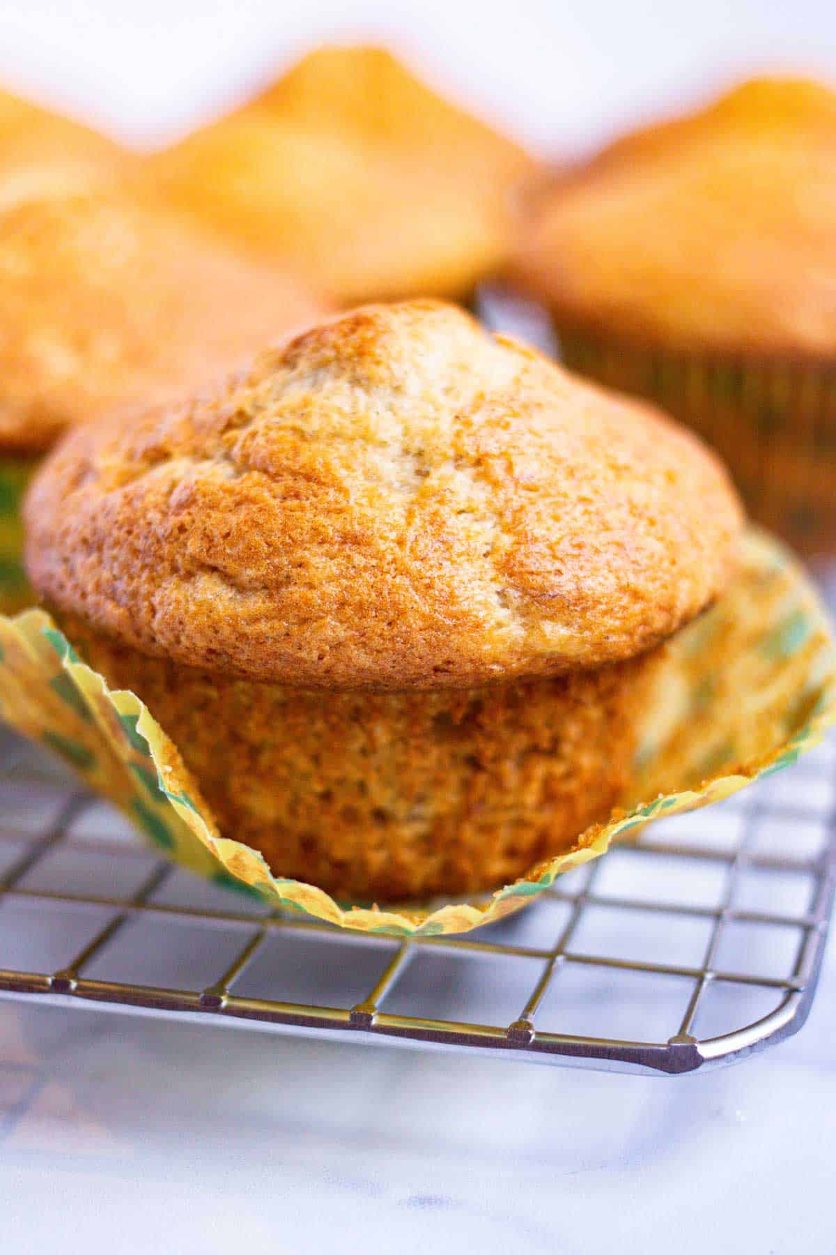 Bisquick banana muffin with baking cup peeled off.