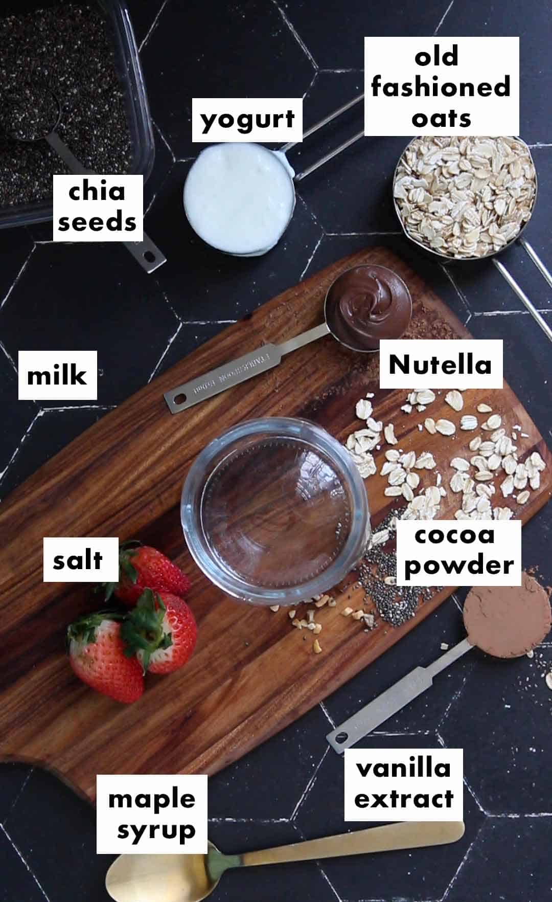Nutella overnight oats ingredients: old fashioned oats, milk, whole milk plain yogurt, maple syrup, Nutella, chia cheese, vanilla extract, cocoa powder, and salt.