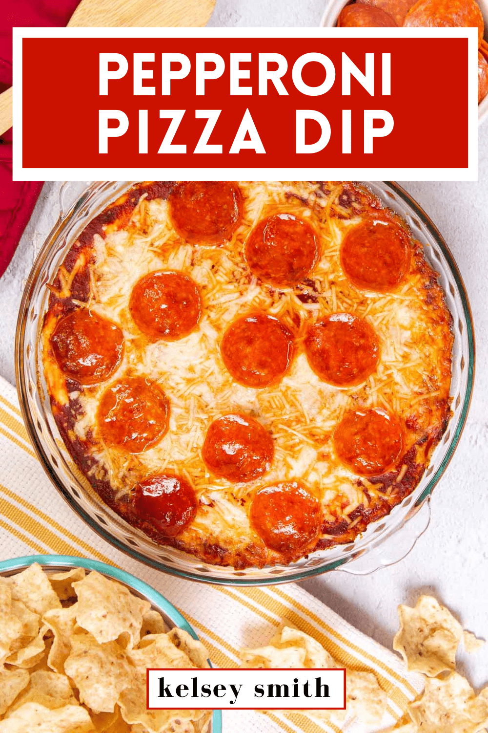 Top down view of pizza dip baked in a pie plate. The dip is topped with pepperoni. Text at the top reads Pepperoni Pizza Dip.
