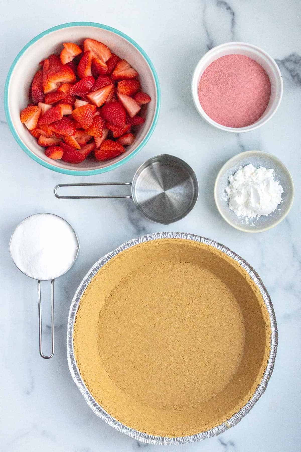 Strawberry Jello Pie Ingredients: fresh strawberries, strawberry jello, corn starch, water, sugar, and a graham cracker pie crust.