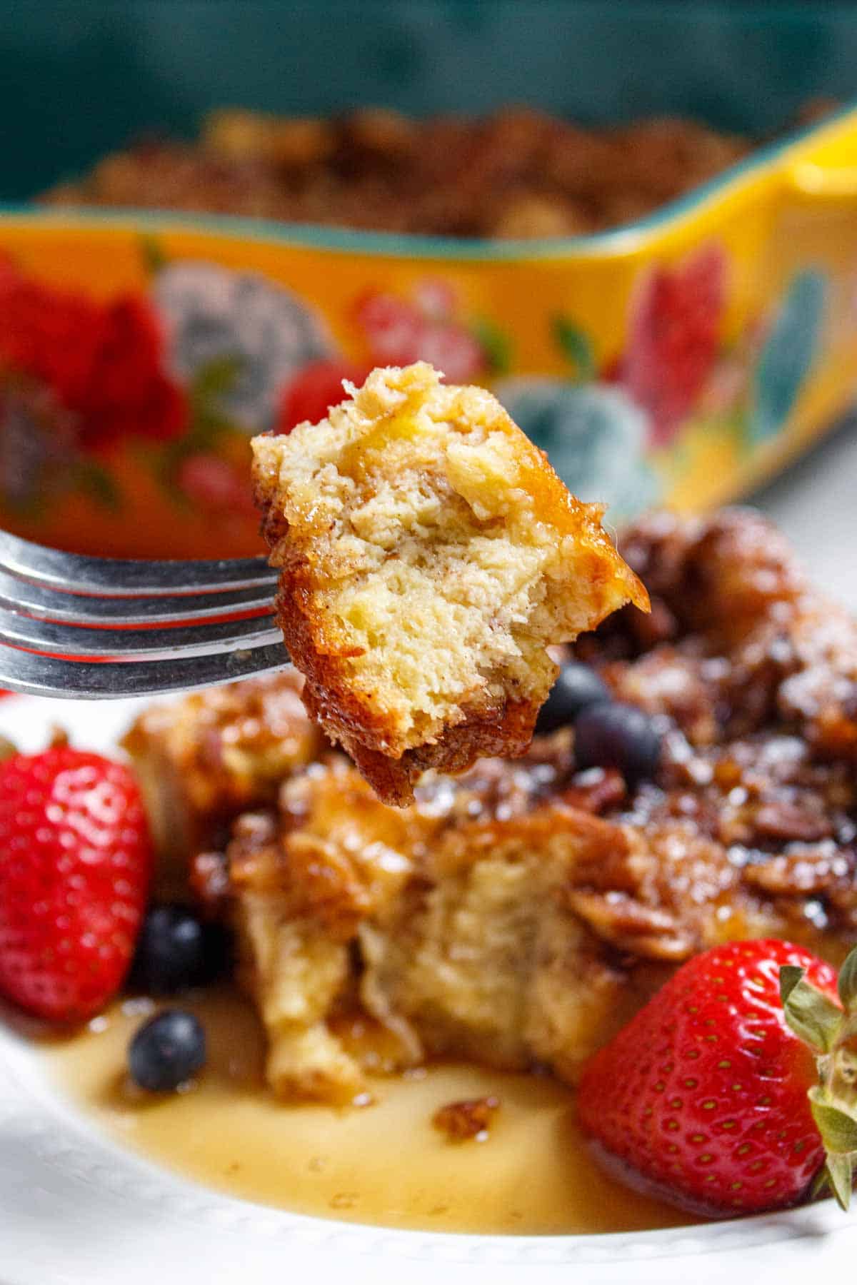 Bite of French toast casserole on a fork.