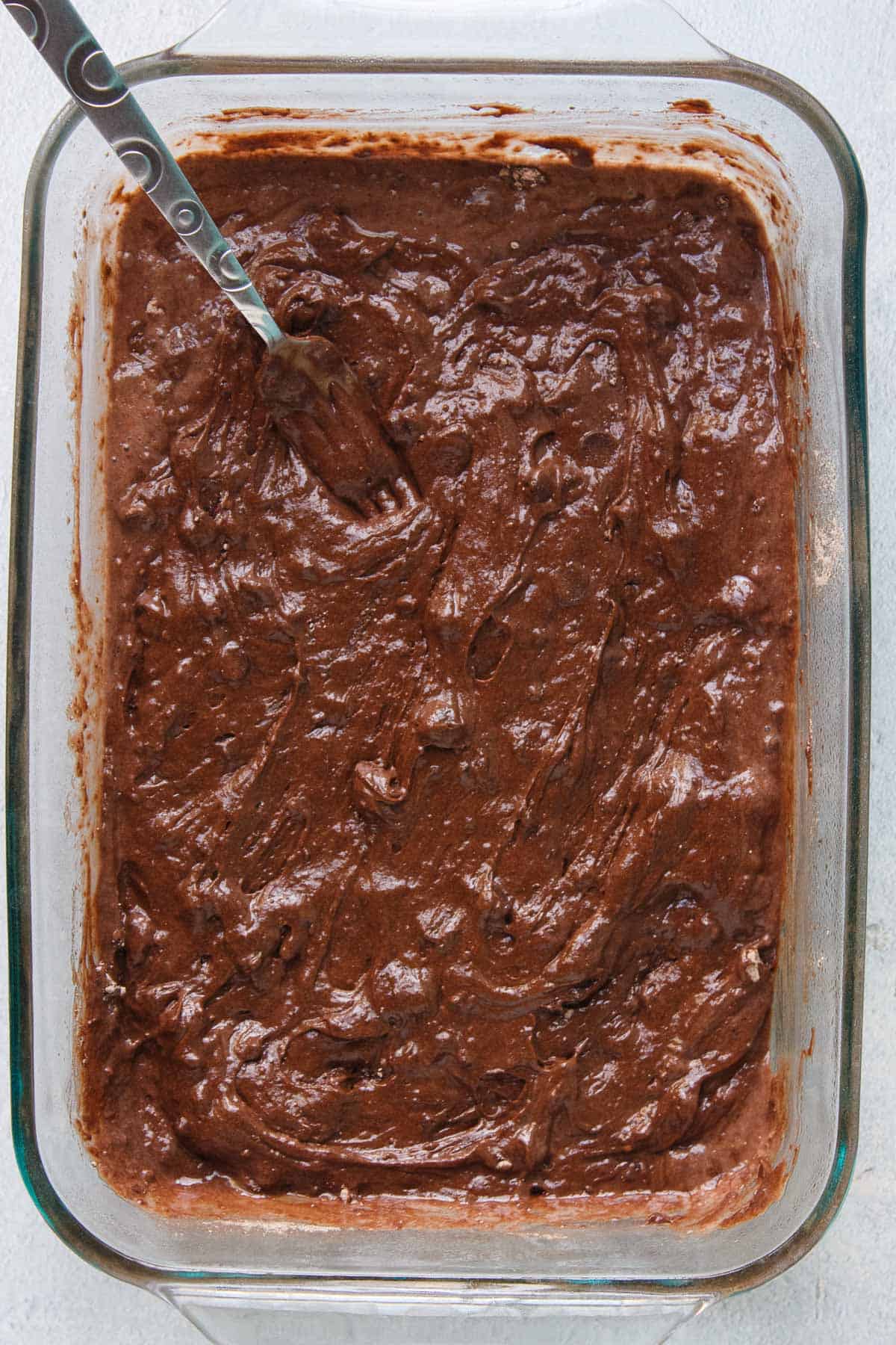 4-Ingredient Chocolate Dump Cake batter in a 9x13 baking dish