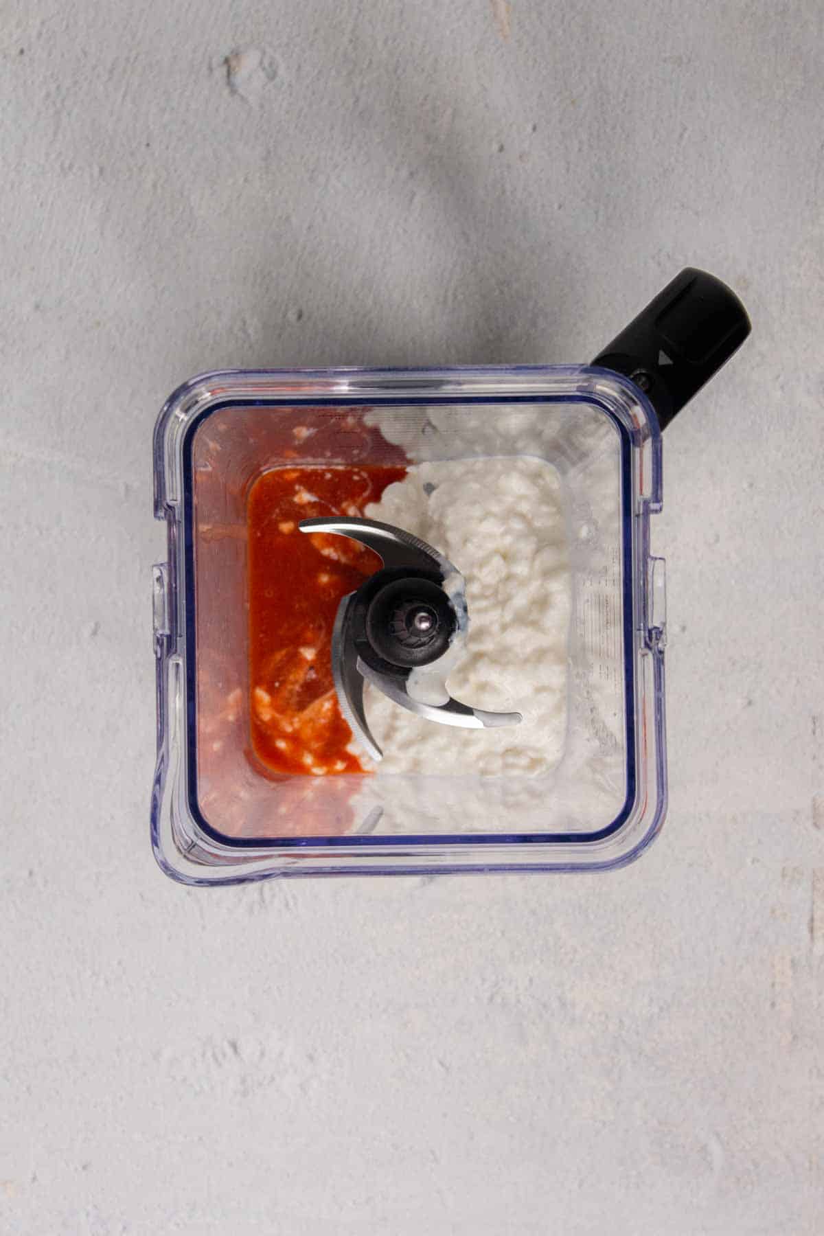 Hot sauce and cottage cheese in blender.