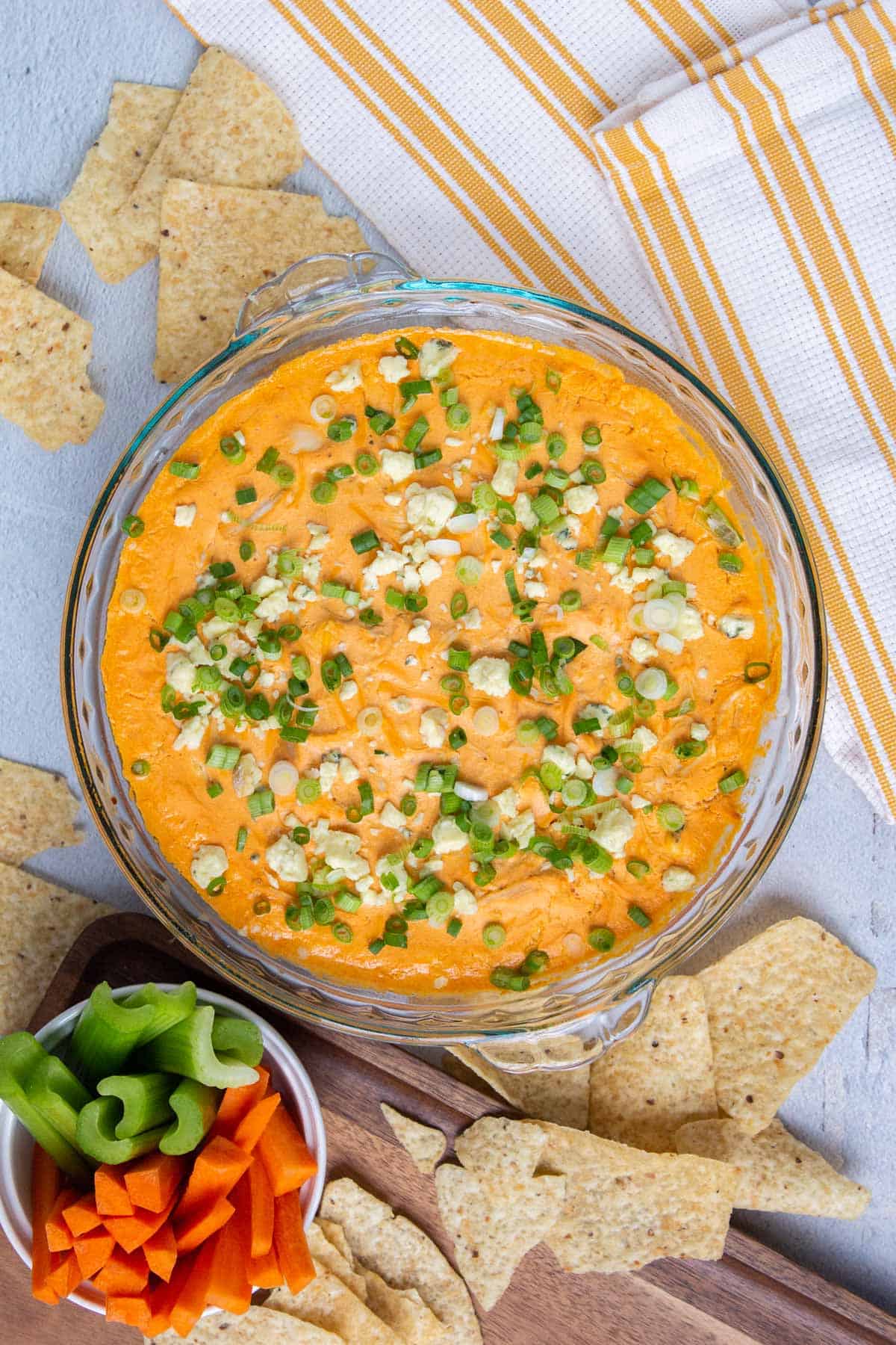 Healthy Buffalo Chicken Dip topped with blue cheese and green onions