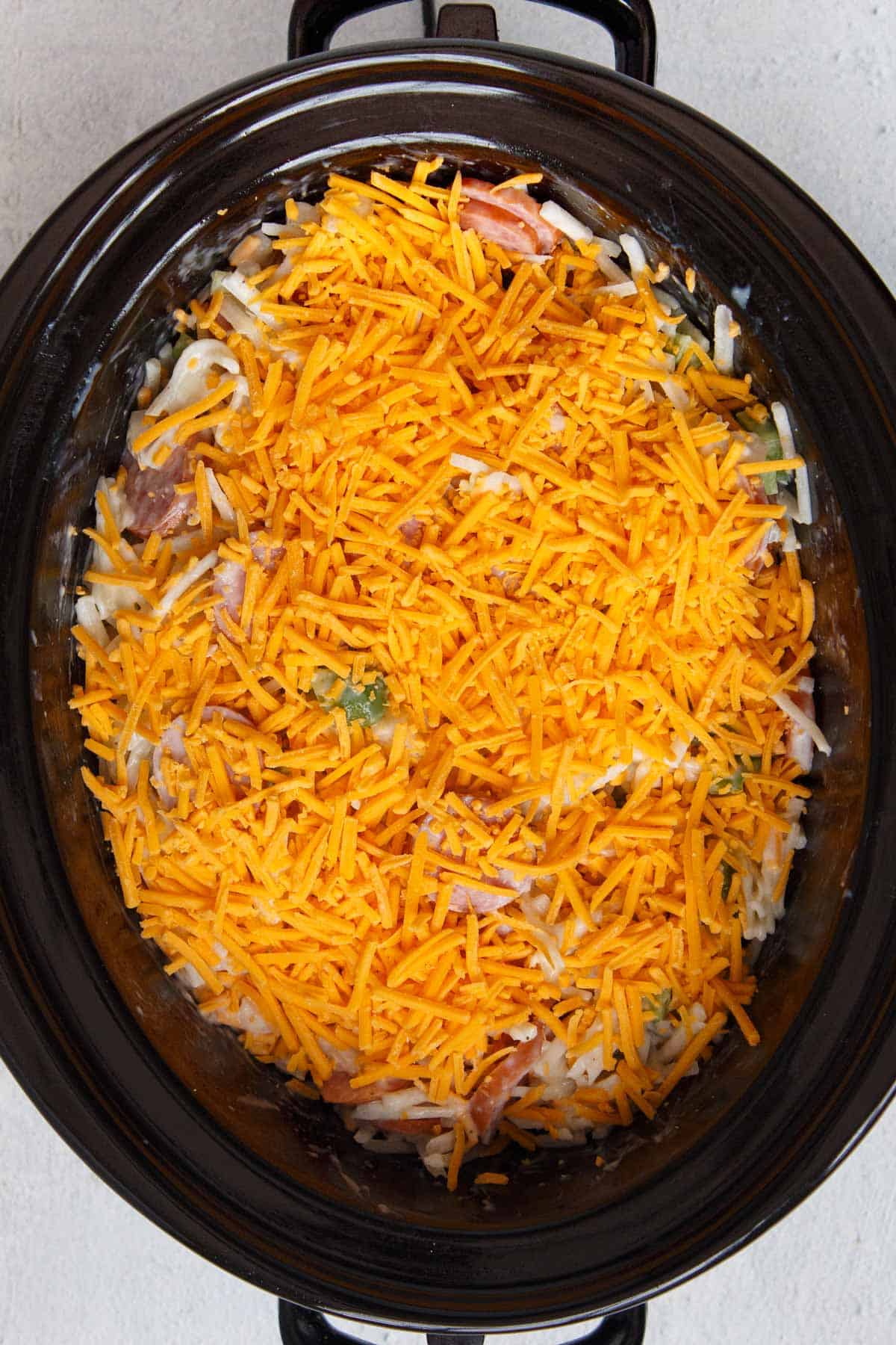 Slow Cooker Cheesy Kielbasa Hash Brown Casserole before cooking