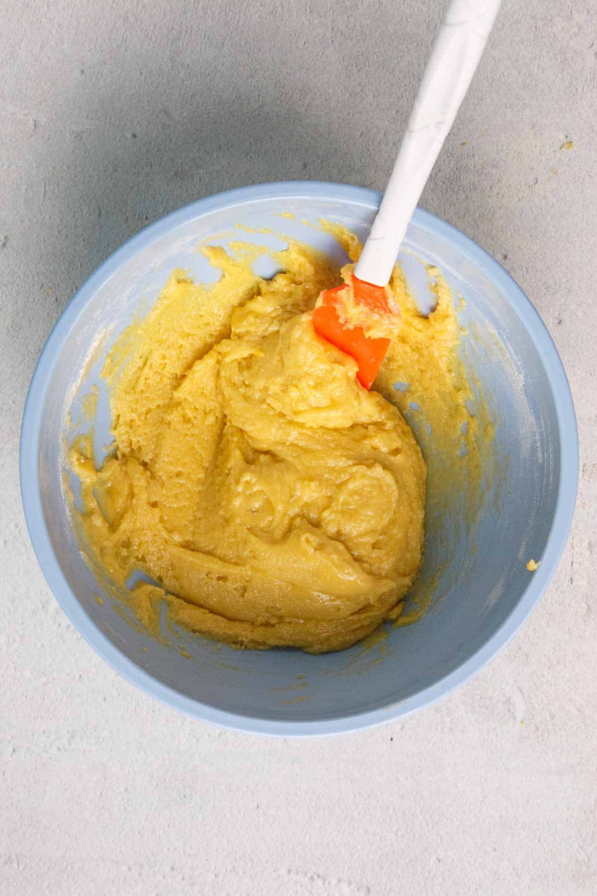 Lemon cookie dough in a mixing bowl