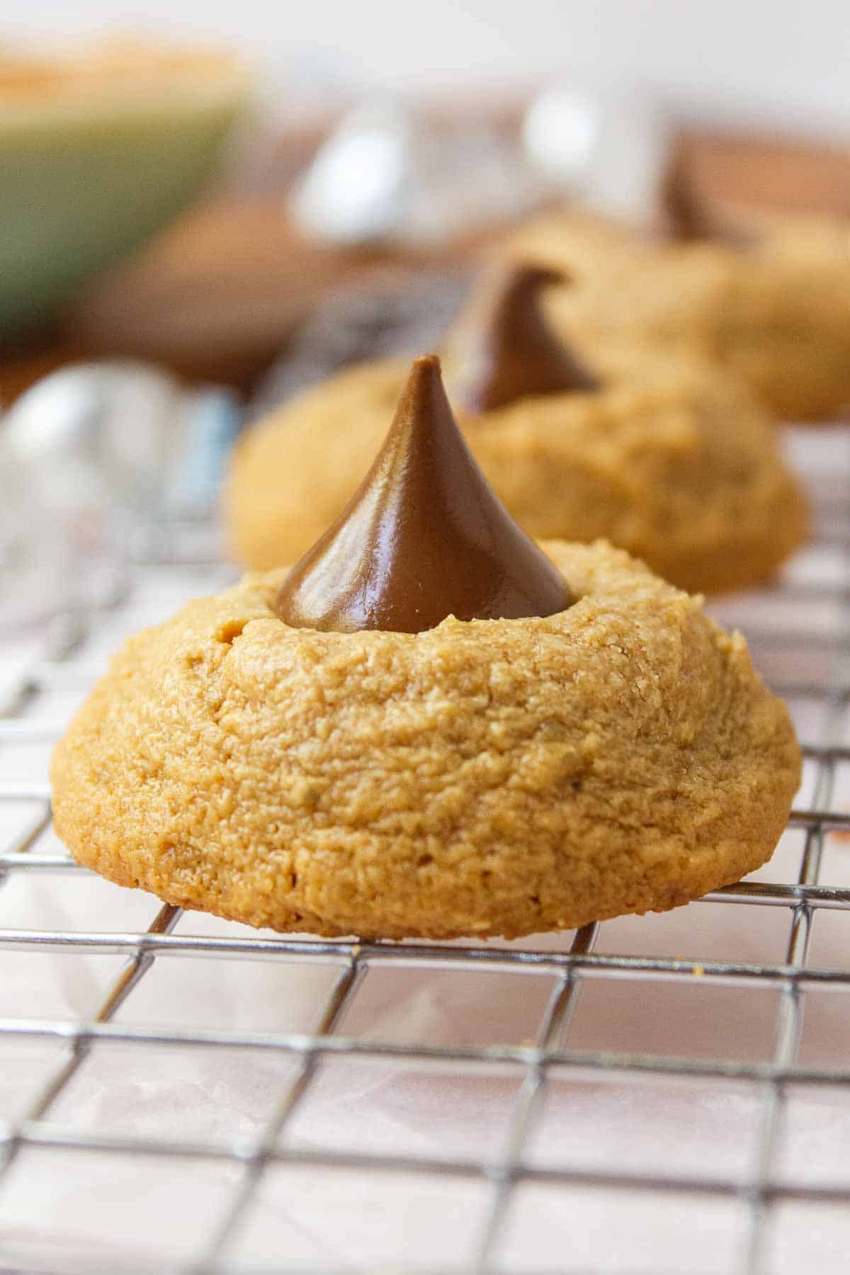 Peanut butter blossom cookie cooling on a wire rack