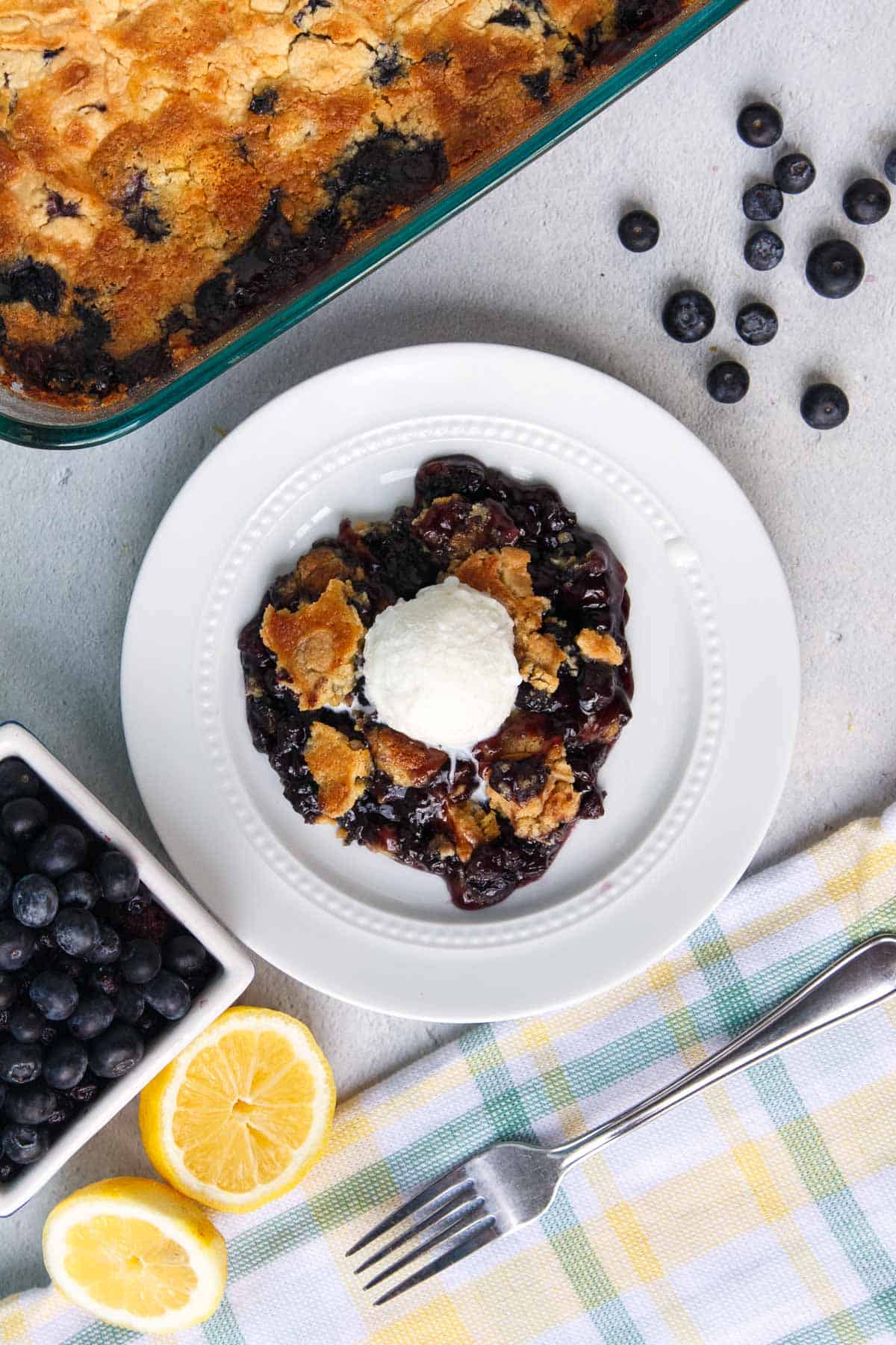 Blueberry Dump Cake topped with ice cream