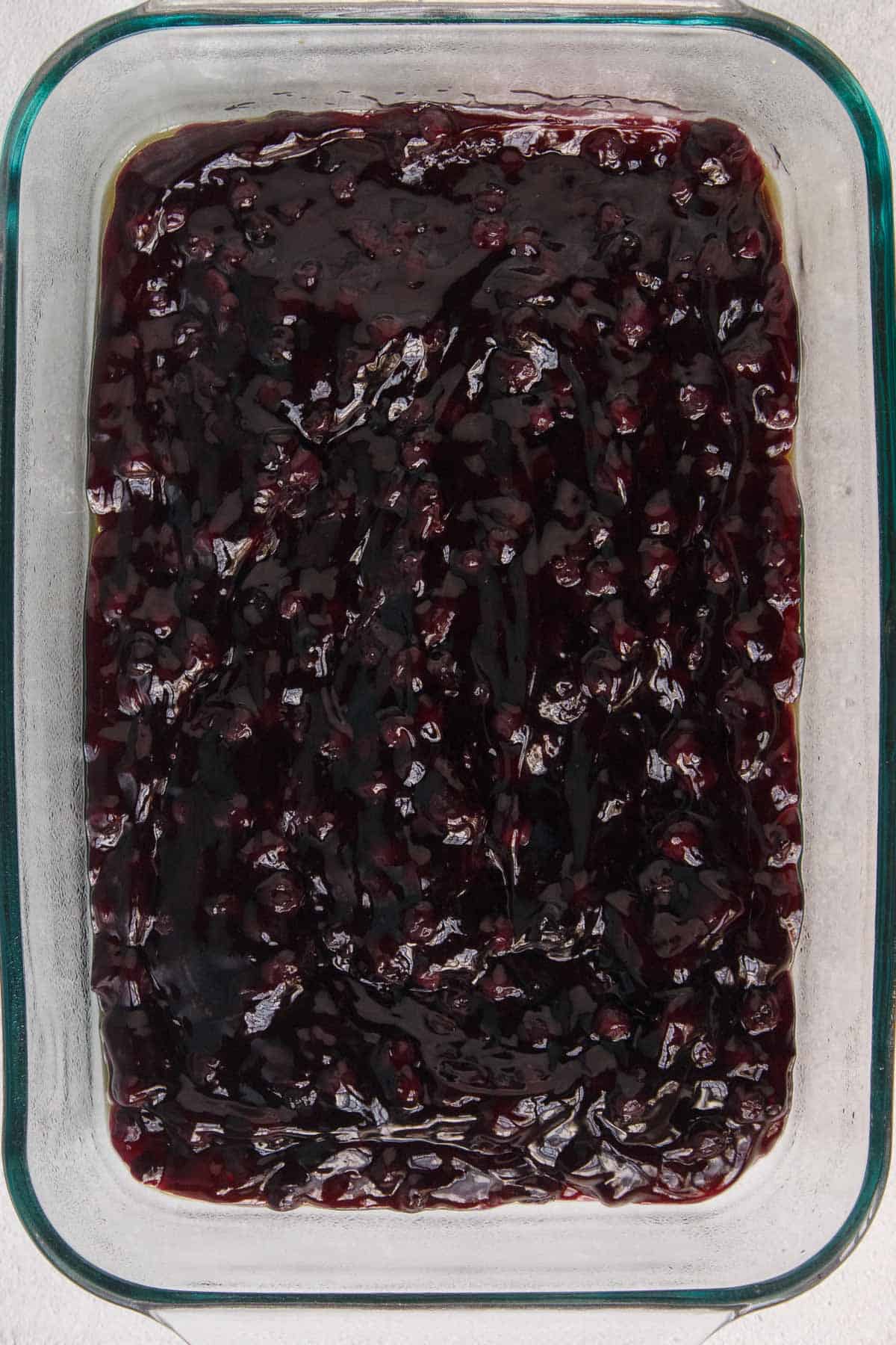 Blueberry pie filling in a 9 by 13 baking dish