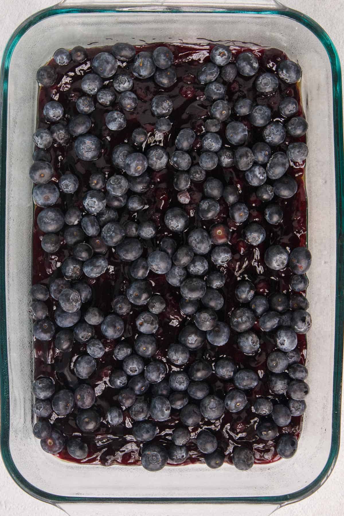 Fresh blueberries spread evenly over pie filling