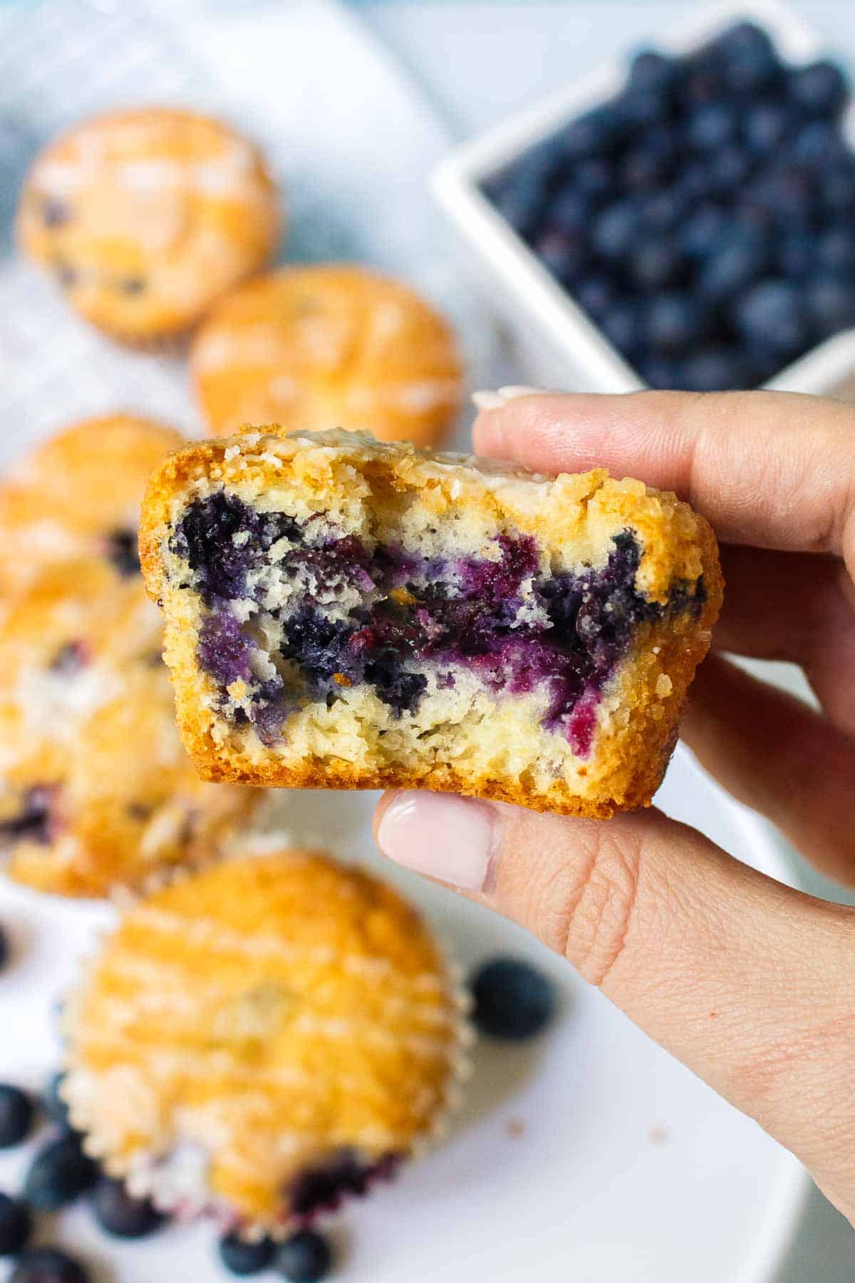A bite is taken out of a blueberry muffin