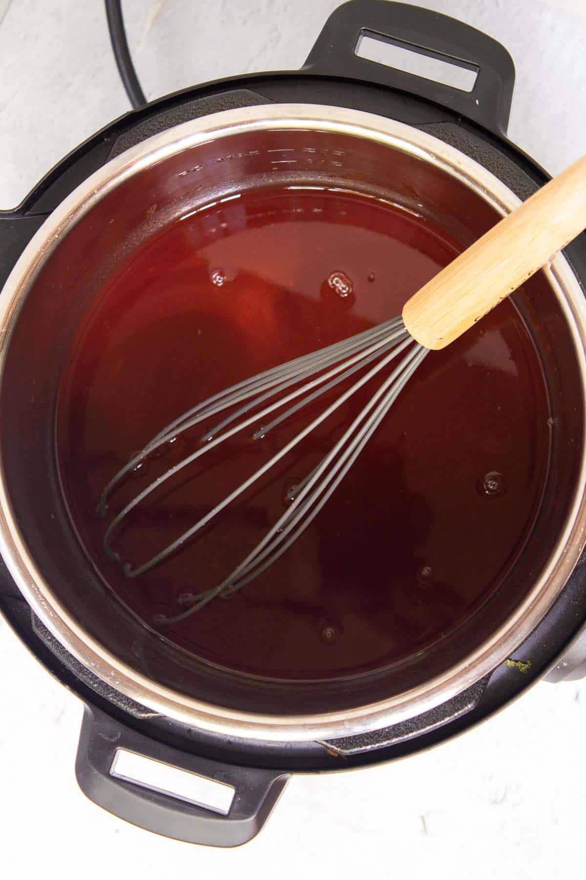 Grape jelly, Heinz chili sauce, and water are mixed together in the Instant Pot