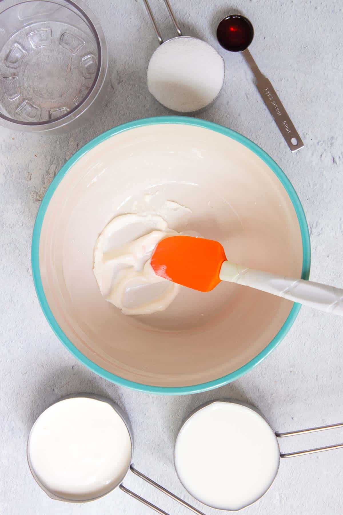 Cream cheese is softened in a large mixing bowl
