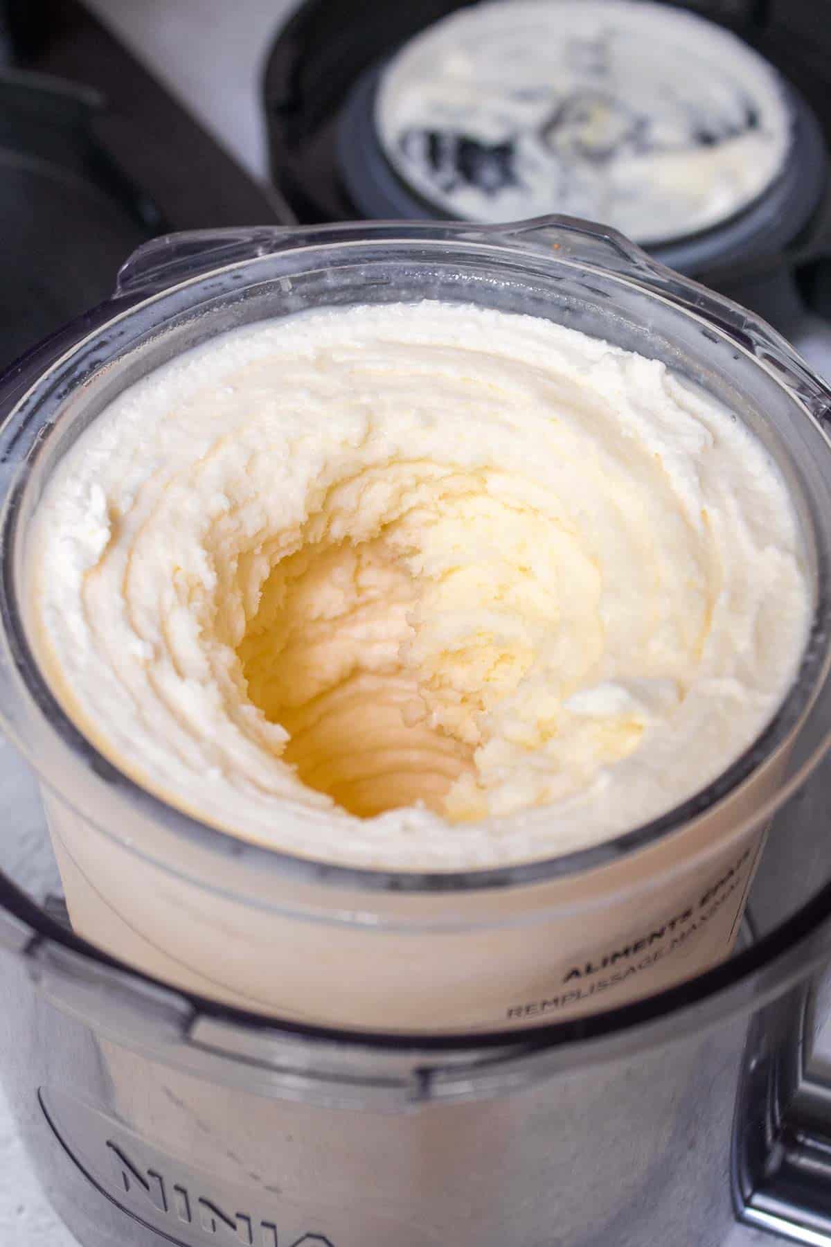 Vanilla protein ice cream is processed and looks smooth in the pint