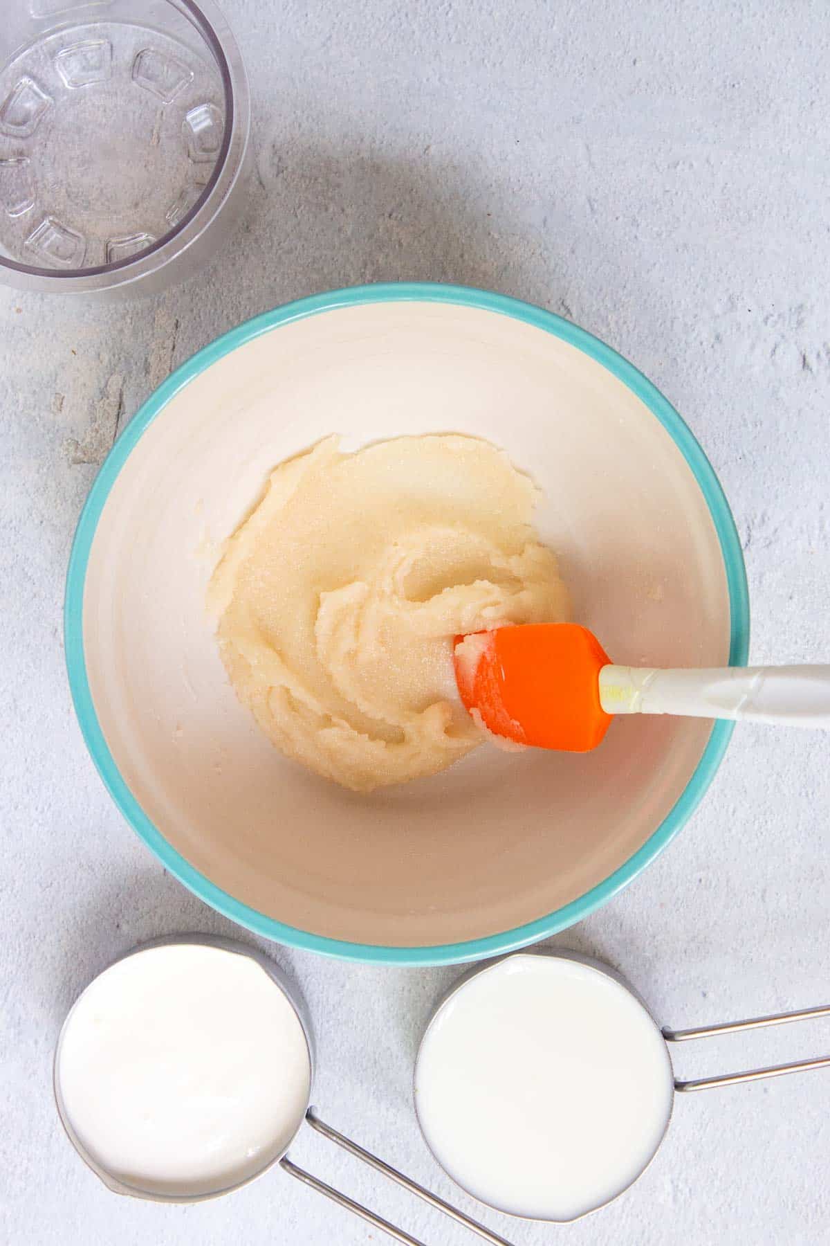 The vanilla and sugar are mixed into the softened ice cream to create a thick paste