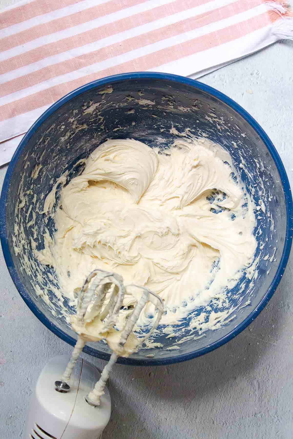 The powdered sugar is fully mixed into the cream cheese mixture