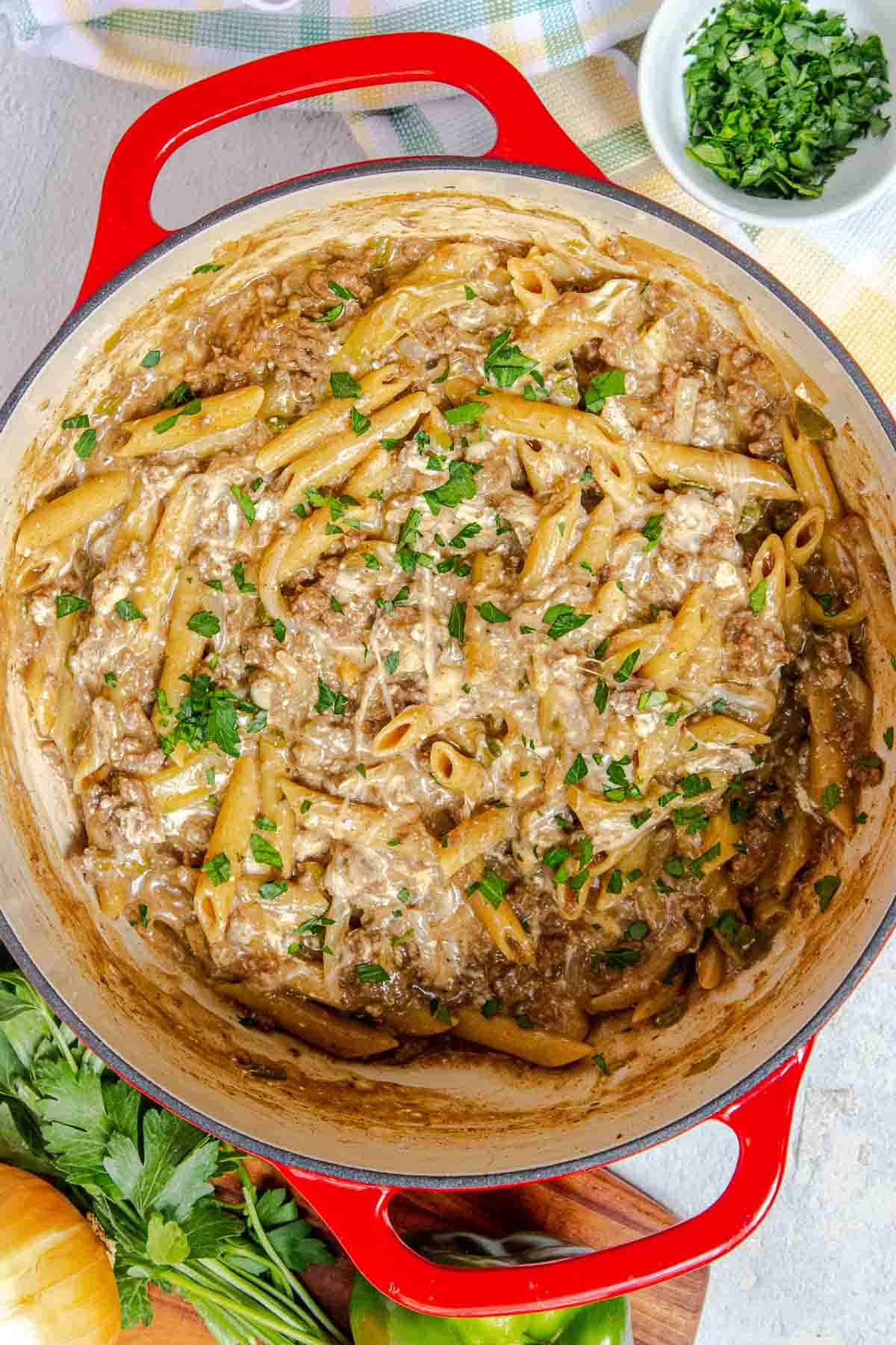 One Pot Philly cheesesteak pasta garnished with chopped fresh parsley