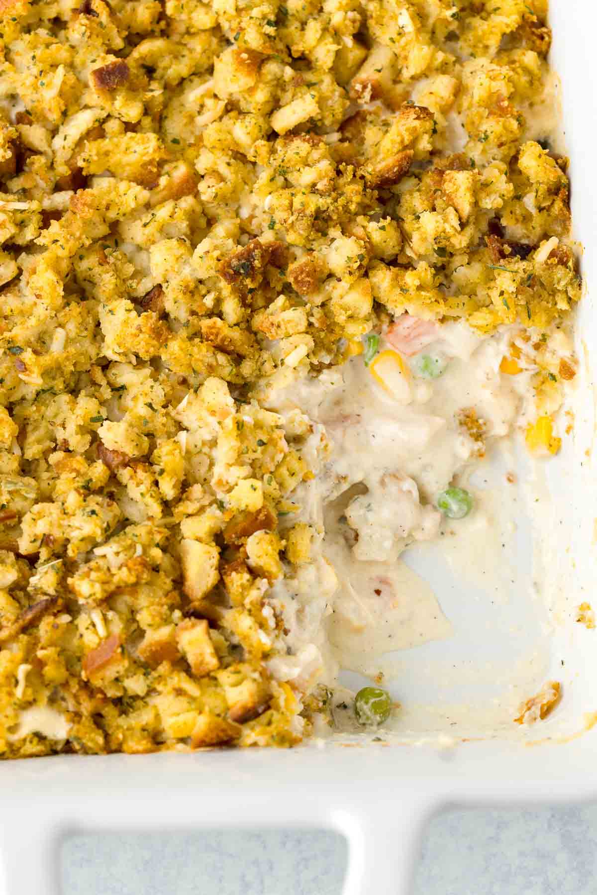 Chicken Stuffing Casserole baked in a casserole dish. The chicken layer is creamy and the stuffing layer is golden.
