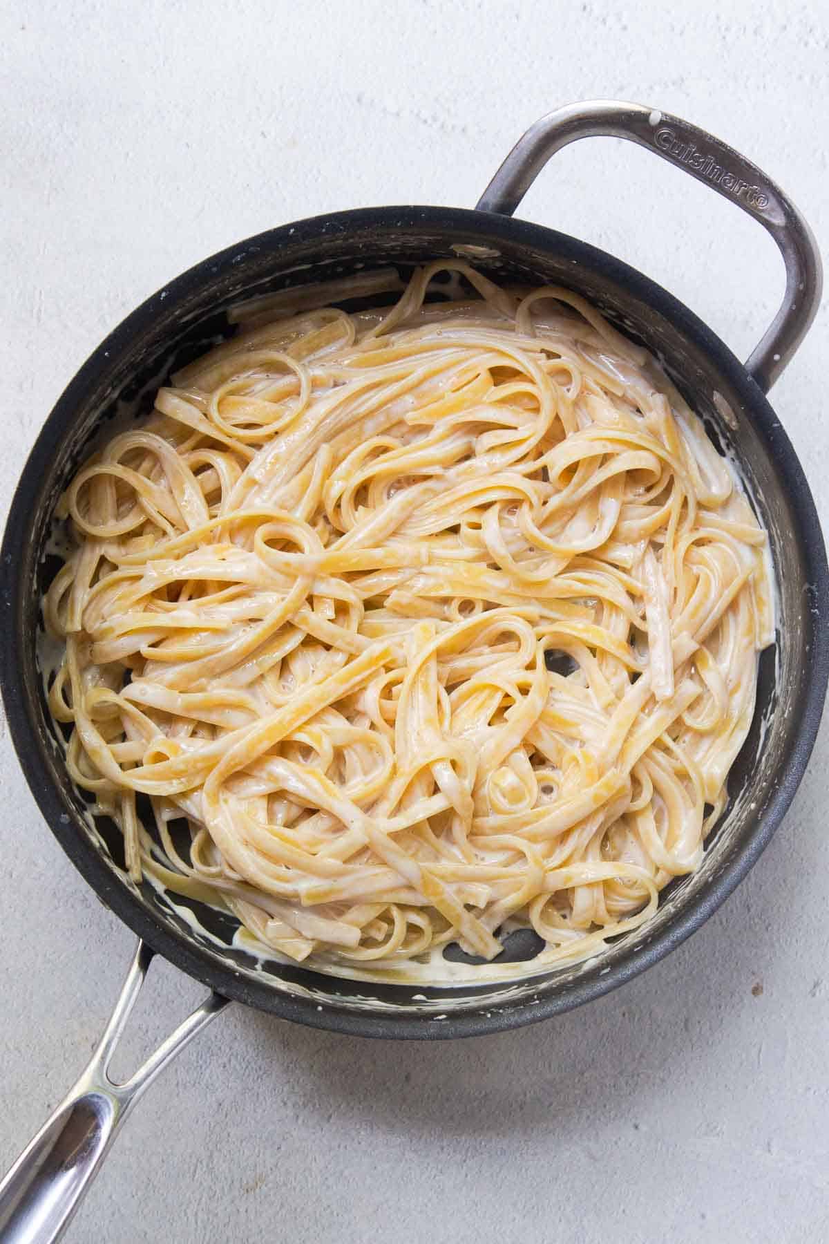 The pasta is cooked until al dente and most of the liquid has been absorbed