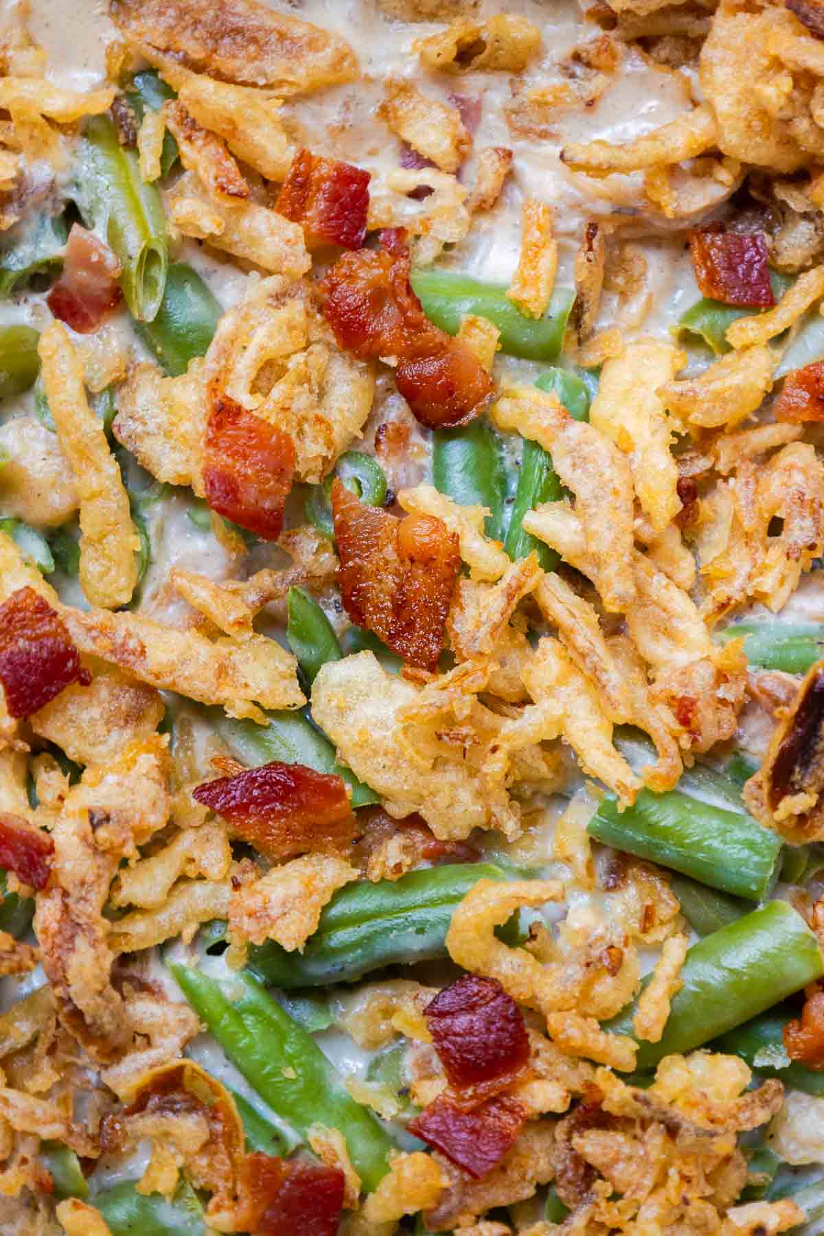 Green bean casserole with bacon and crispy fried onions.