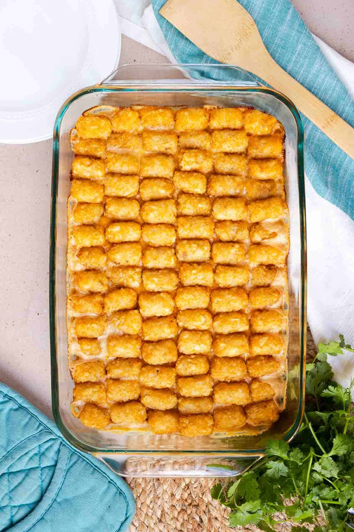 The casserole is baked until the tater tots are golden brown and the casserole filling is bubbling.