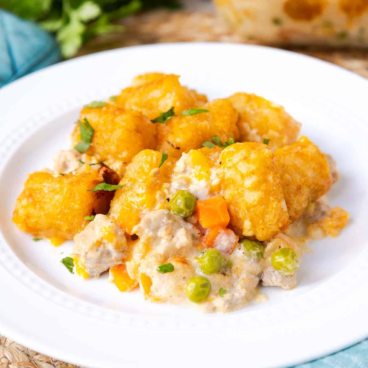 turkey tater tot casserole with peas and carrots in a creamy sauce