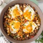 Breakfast sausage potato skillet with eggs and cheese.