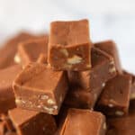 One inch squares of Velveeta fudge stacked into a pyramid.