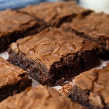 Fudgy brownie squares with melted chocolate chips visible from the sides.