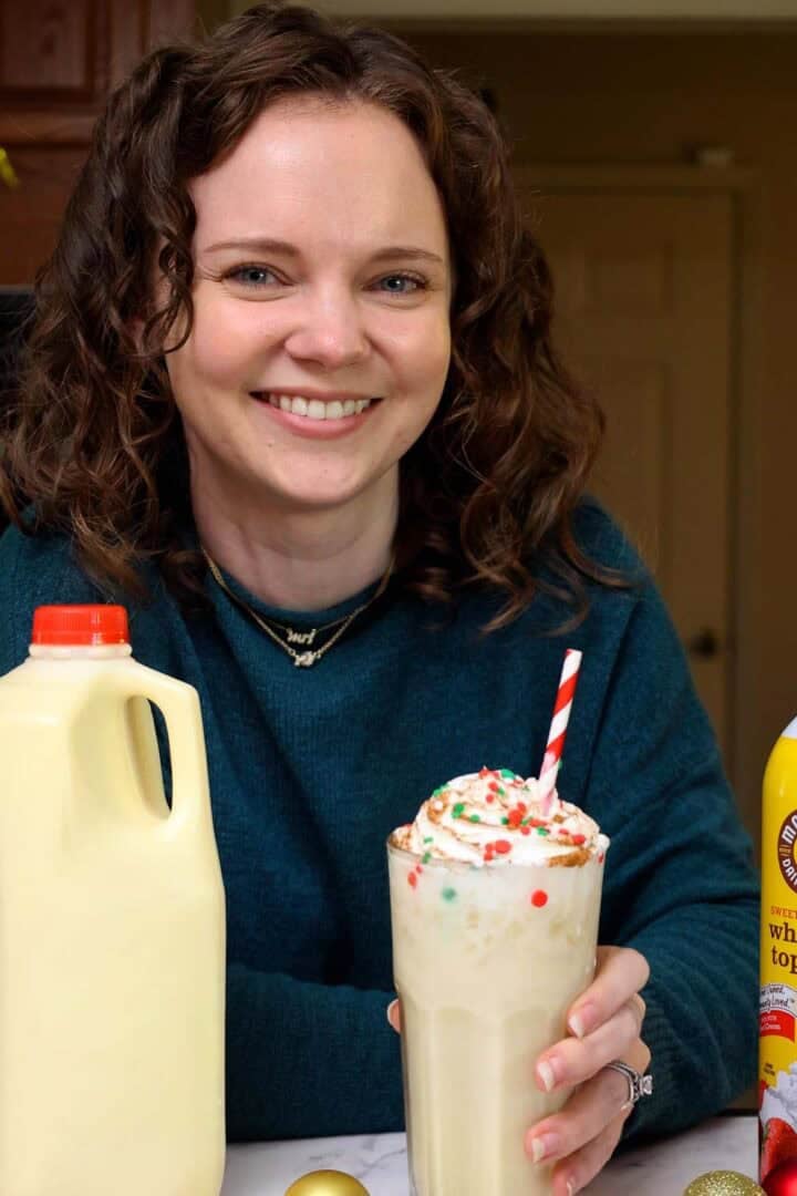 Kelsey Smith with a glass of eggnog dirty soda in hand.